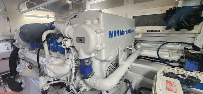 Slide: The Image of Engine room of 2004 Cabo 48 Convertible with MAN Marine Diesel engine. - 47