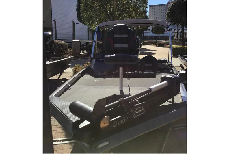 Slide: The Image of 2020 Ranger RT178 boat with trolling motor, parked outdoors. - 3