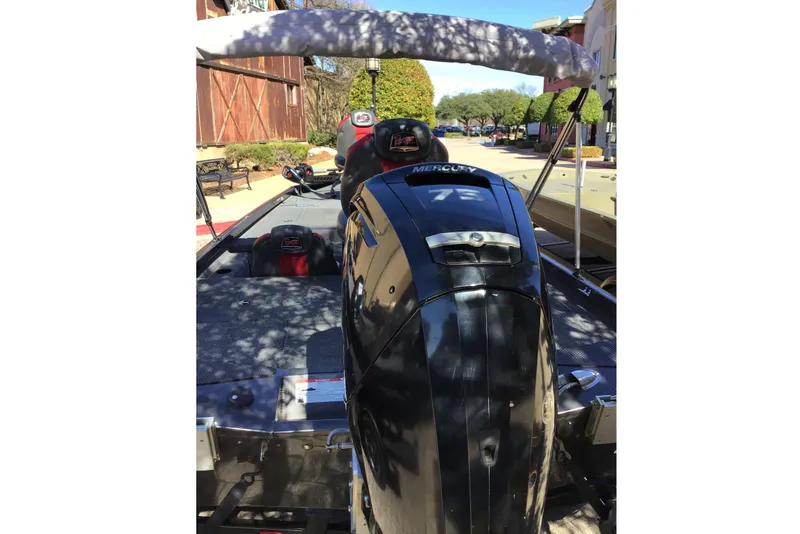 Slide: The Image of 2020 Ranger RT178 boat with Mercury 75 engine, parked outdoors. - 4