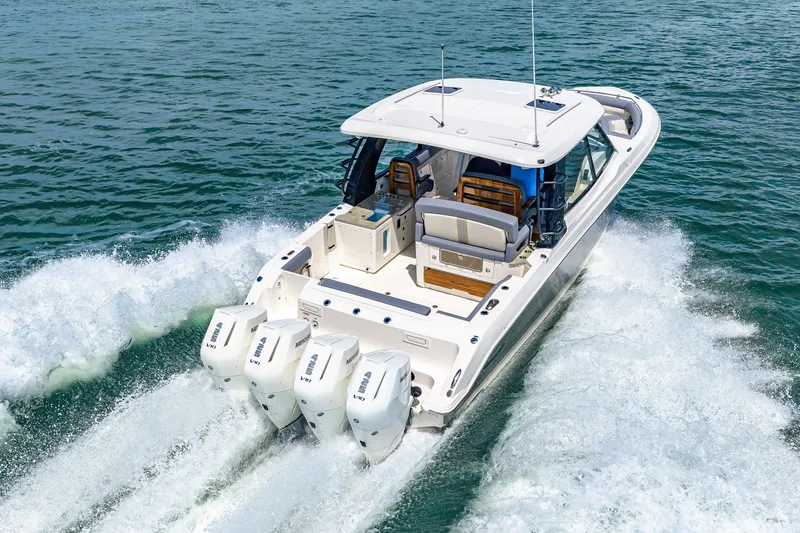 Slide: The Image of Boston Whaler 380 Realm 2026 on the water with four outboard engines. - 33