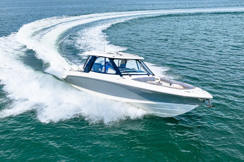 Slide: The Image of Boston Whaler 380 Realm from 2026 cruising swiftly on open water. - 28