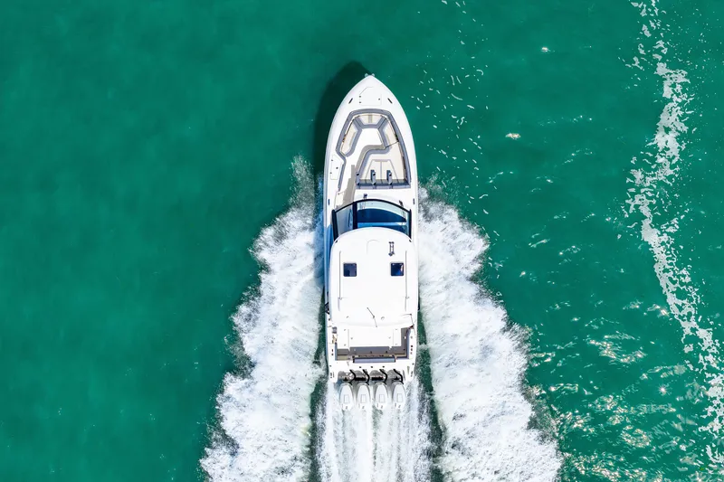 Slide: The Image of Aerial view of a 2026 Boston Whaler 380 Realm on turquoise water. - 35