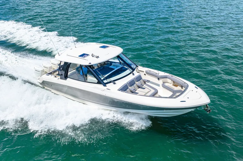 Slide: The Image of 2026 Boston Whaler 380 Realm on the water, featuring sleek design and spacious deck. - 39