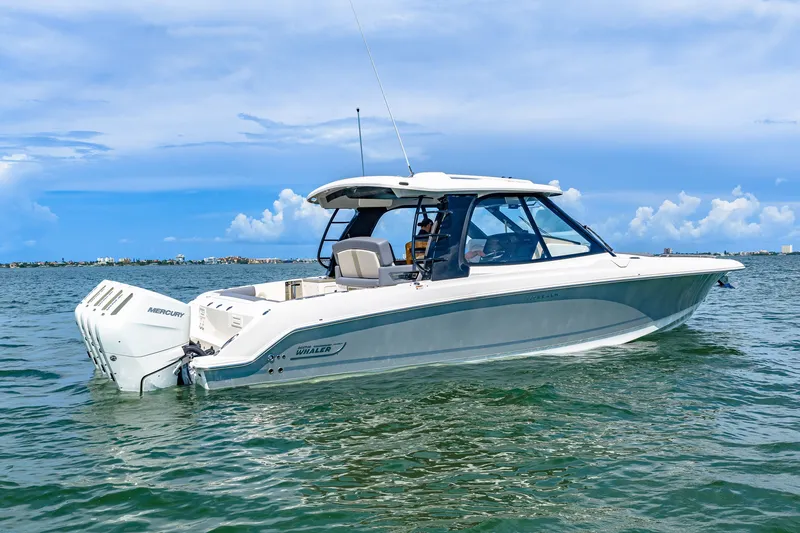 Slide: The Image of A sleek, modern boat on calm water with a clear sky in the background. - 19