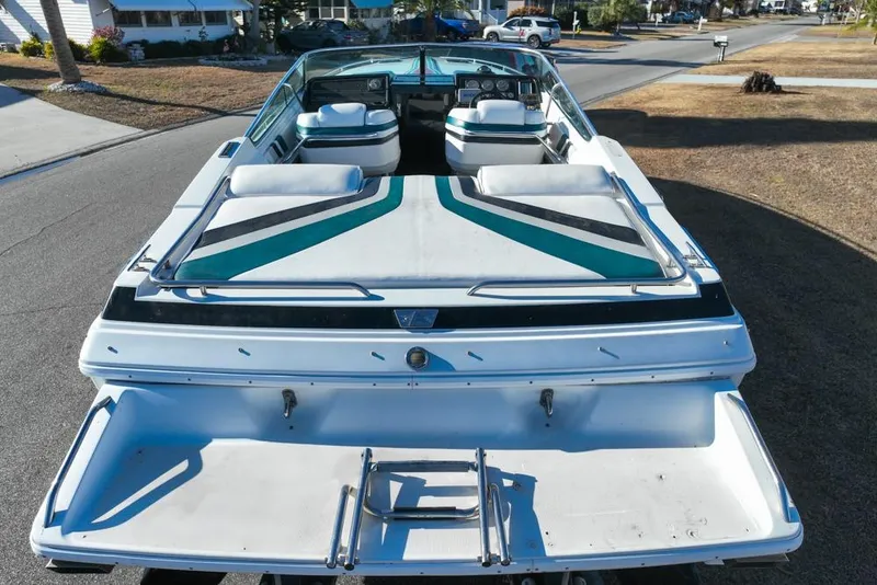 Slide: The Image of 1989 Formula 292 SR-1 boat, rear view, parked on a residential street. - 16