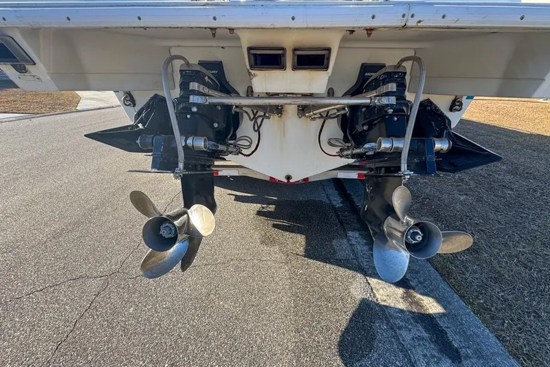 Slide: The Image of 1989 Formula 292 SR-1 boat stern with dual propellers and outboard motors. - 19