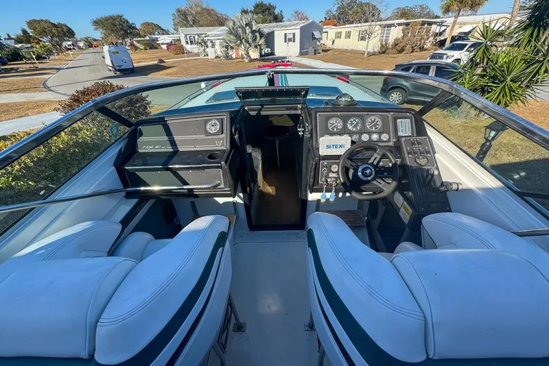 Slide: The Image of 1989 Formula 292 SR-1 boat cockpit with steering wheel and dashboard controls. - 23