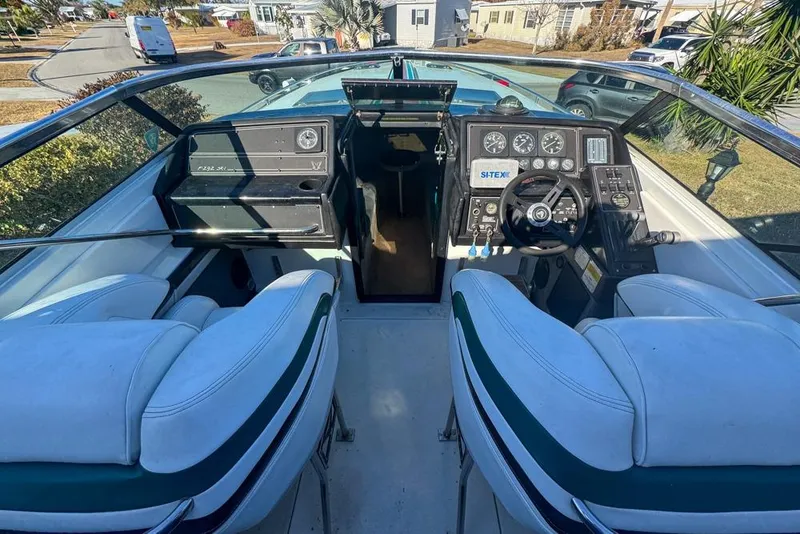 Slide: The Image of 1989 Formula 292 SR-1 boat cockpit with dual seats and control panel. - 25