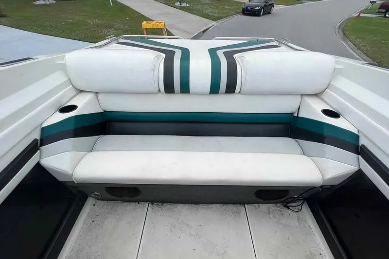 Slide: The Image of 1989 Formula 292 SR-1 boat interior with striped seating and cup holders. - 29