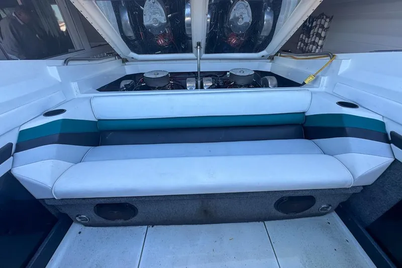 Slide: The Image of 1989 Formula 292 SR-1 boat interior with engine compartment open, showcasing seating and engine details. - 31