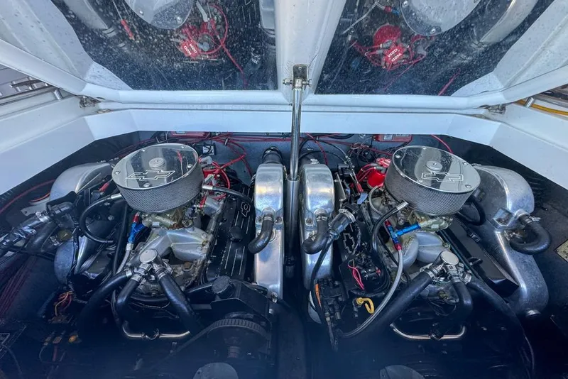 Slide: The Image of Engine compartment of a 1989 Formula 292 SR-1 boat, featuring dual engines. - 34