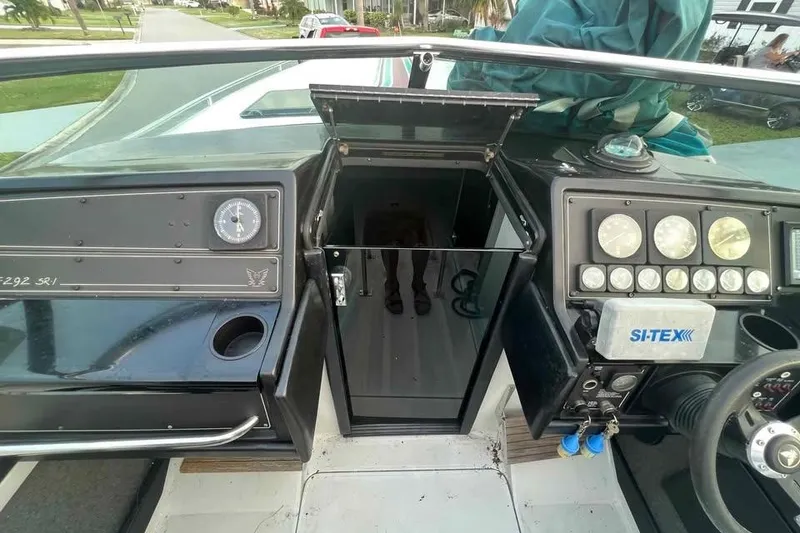 Slide: The Image of 1989 Formula 292 SR-1 boat dashboard with open cabin door and navigation instruments. - 39