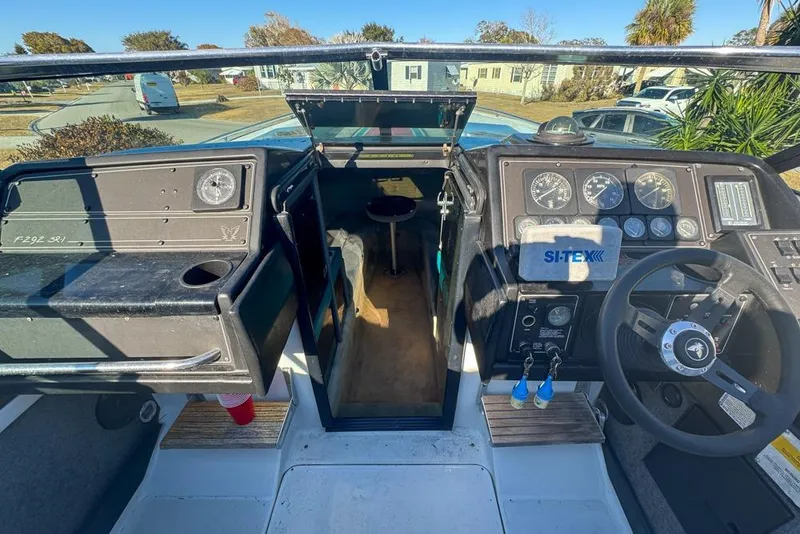 Slide: The Image of 1989 Formula 292 SR-1 boat cockpit with steering wheel and dashboard instruments. - 40