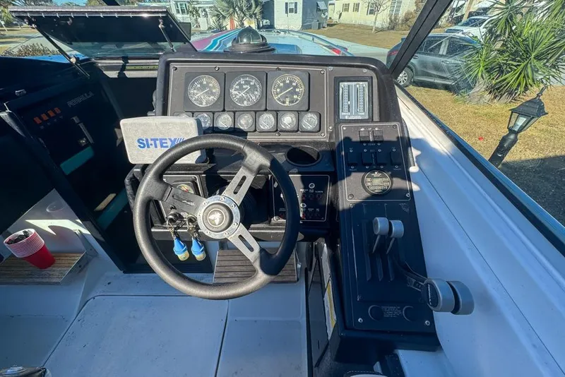 Slide: The Image of 1989 Formula 292 SR-1 boat dashboard with steering wheel and control panel. - 41