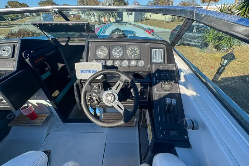 Slide: The Image of 1989 Formula 292 SR-1 boat cockpit with steering wheel and control panel. - 42