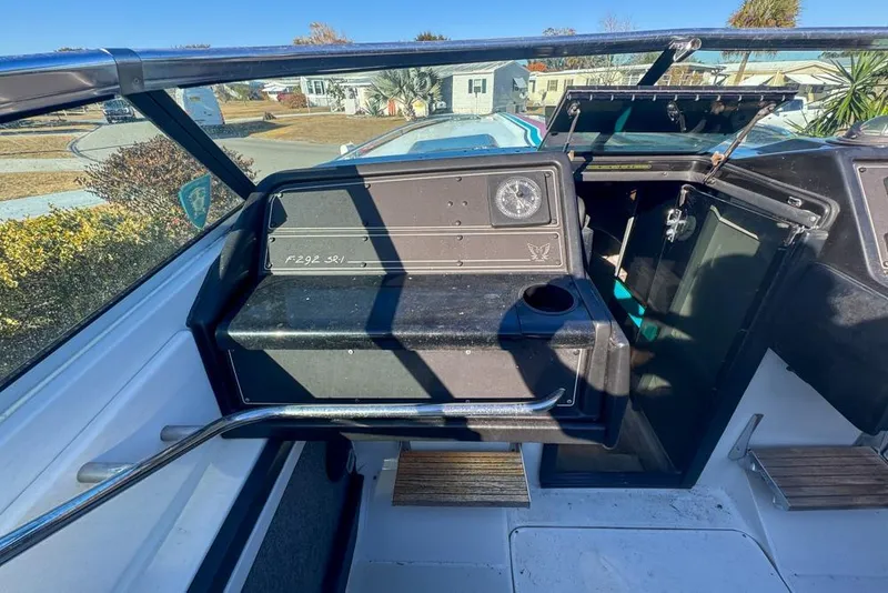 Slide: The Image of 1989 Formula 292 SR-1 boat interior with dashboard and open compartment. - 45