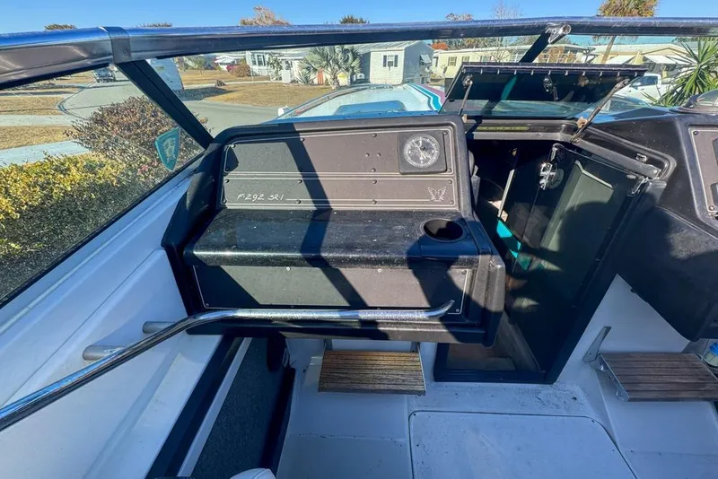 Slide: The Image of 1989 Formula 292 SR-1 boat cockpit with dashboard and open cabin door. - 46