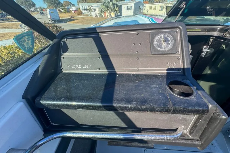 Slide: The Image of 1989 Formula 292 SR-1 boat dashboard with compass and cup holder. - 47