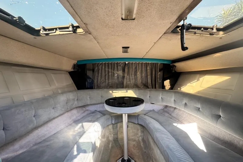 Slide: The Image of Interior of 1989 Formula 292 SR-1 boat with plush seating and table. - 49