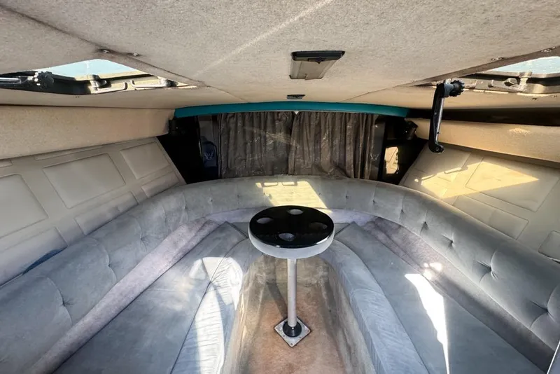 Slide: The Image of Interior of 1989 Formula 292 SR-1 boat with cushioned seating and table. - 51