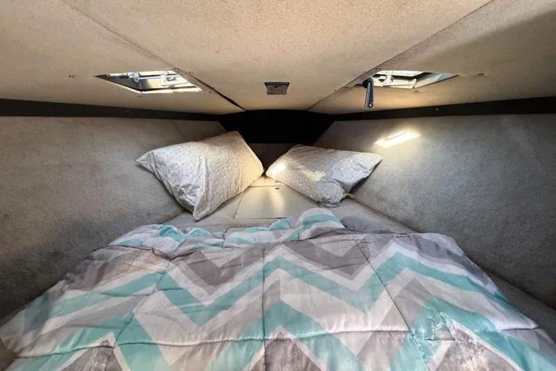 Slide: The Image of Cozy cabin interior of 1989 Formula 292 SR-1 boat with bedding and pillows. - 55