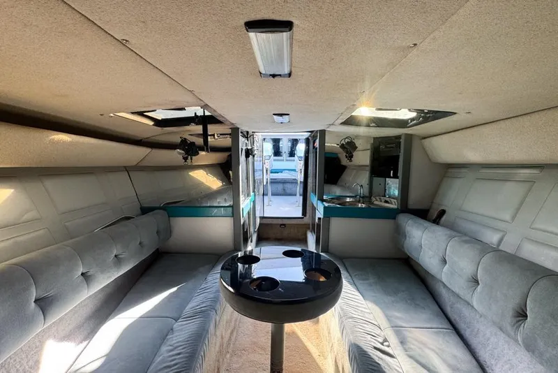 Slide: The Image of Interior of a 1989 Formula 292 SR-1 boat with seating and kitchenette. - 57