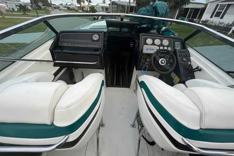 Slide: The Image of 1989 Formula 292 SR-1 speedboat on trailer, parked on residential street. - 6