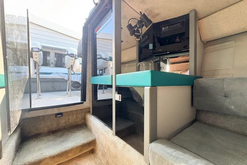 Slide: The Image of Interior of a 1989 Formula 292 SR-1 boat with seating and kitchenette. - 62