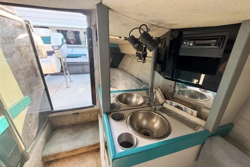Slide: The Image of Interior of 1989 Formula 292 SR-1 boat with kitchenette and seating area. - 70