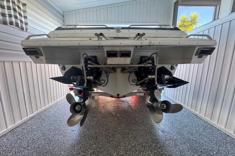 Slide: The Image of 1989 Formula 292 SR-1 boat in garage, rear view showing dual propellers. - 72