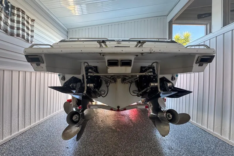 Slide: The Image of 1989 Formula 292 SR-1 boat in a garage, showcasing dual propellers and sleek design. - 73
