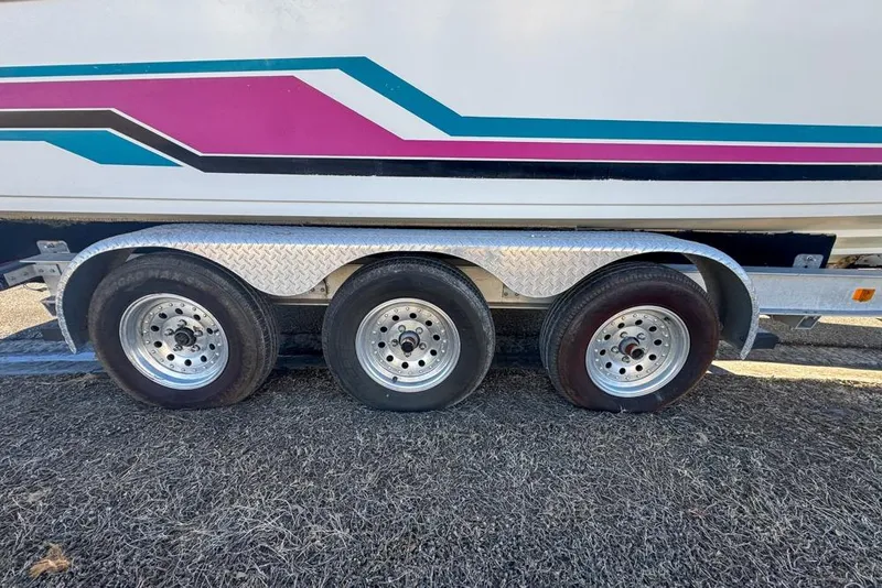 Slide: The Image of Triple-axle trailer with colorful 1989 Formula 292 SR-1 boat design. - 81