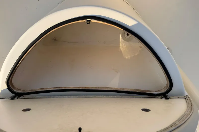 Slide: The Image of 2015 Cobia 201 Center Console storage compartment, open and empty. - 22
