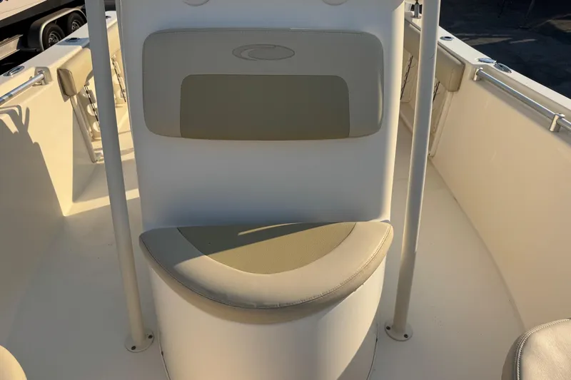 Slide: The Image of 2015 Cobia 201 Center Console boat interior with cushioned seating. - 23