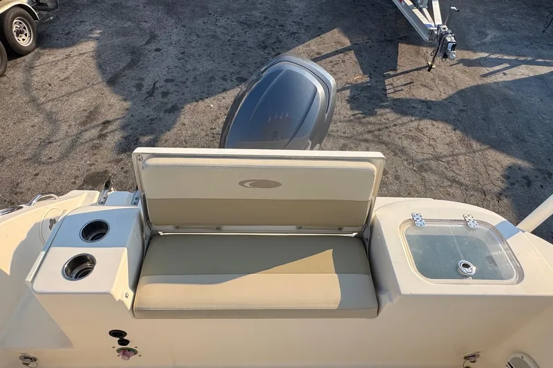 Slide: The Image of 2015 Cobia 201 Center Console boat with seating and cup holders. - 25