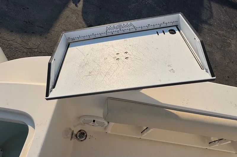 Slide: The Image of Cutting board on 2015 Cobia 201 Center Console boat deck. - 27