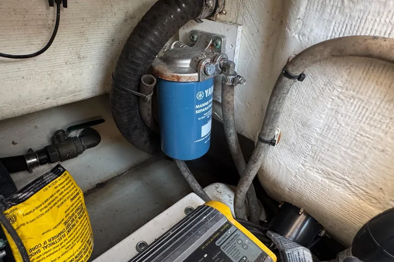Slide: The Image of Engine compartment of 2015 Cobia 201 Center Console with Yamaha fuel filter. - 31