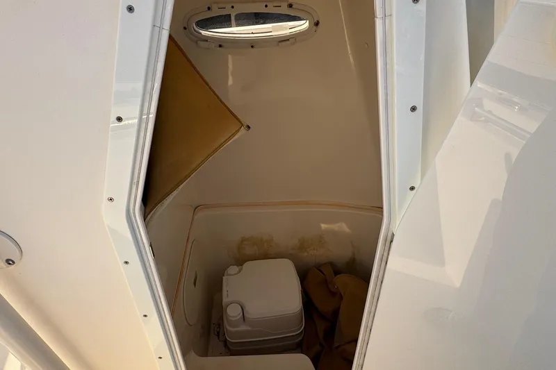Slide: The Image of Interior view of 2015 Cobia 201 Center Console boat storage compartment. - 34