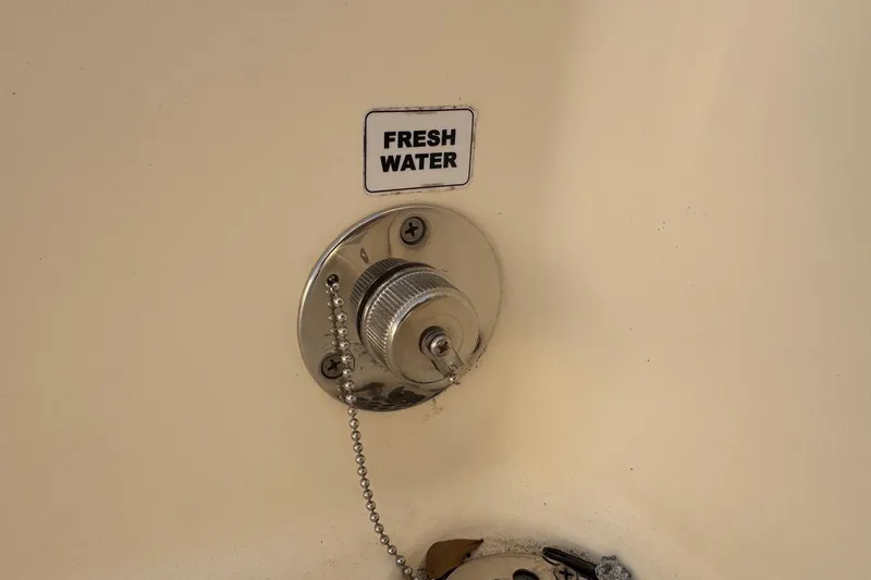 Slide: The Image of Fresh water outlet on 2015 Cobia 201 Center Console boat. - 38