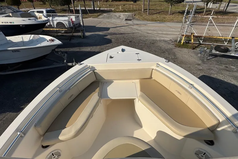 Slide: The Image of 2015 Cobia 201 Center Console boat with spacious seating and sleek design. - 5