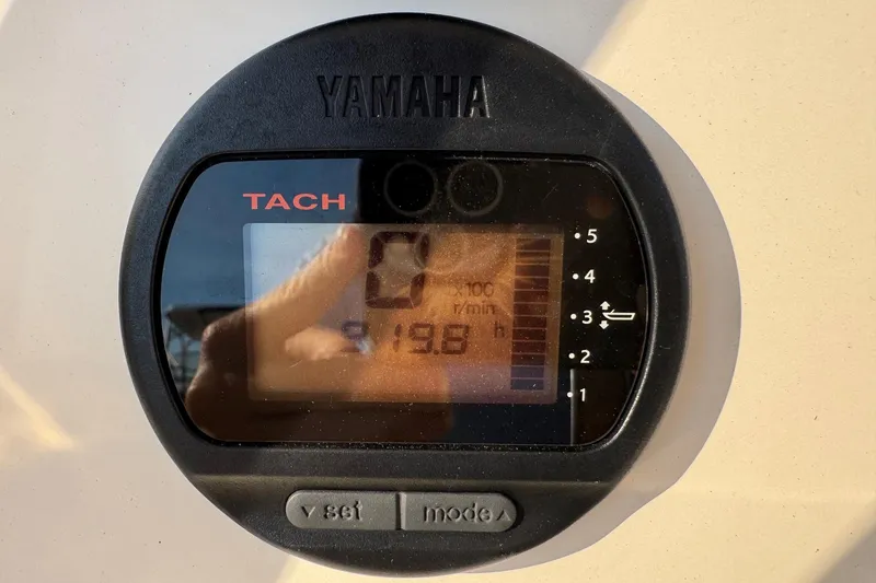 Slide: The Image of Yamaha tachometer on 2015 Cobia 201 Center Console boat, displaying 198 hours. - 9
