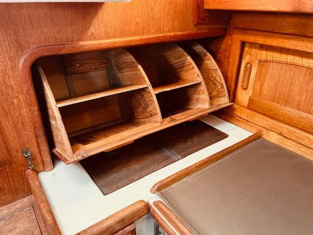 Slide: The Image of Interior of 1986 Pacific Seacraft 34 sailboat with wooden storage compartments. - 16