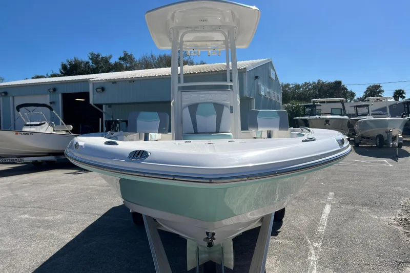 Slide: The Image of 2024 Robalo 226 Cayman boat displayed outdoors, showcasing sleek design and modern features. - 2