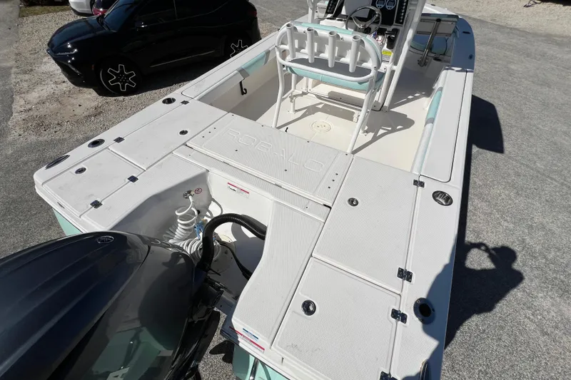 Slide: The Image of 2024 Robalo 226 Cayman boat interior with seating and control console. - 8