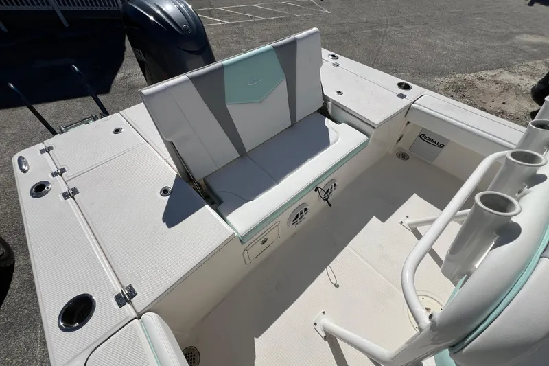 Slide: The Image of 2024 Robalo 226 Cayman boat interior with seating and storage compartments. - 9
