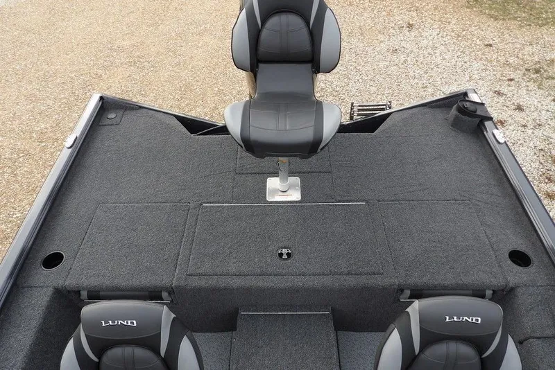 Slide: The Image of 2026 Lund 1875 Renegade boat interior with gray seating and carpeted deck. - 15