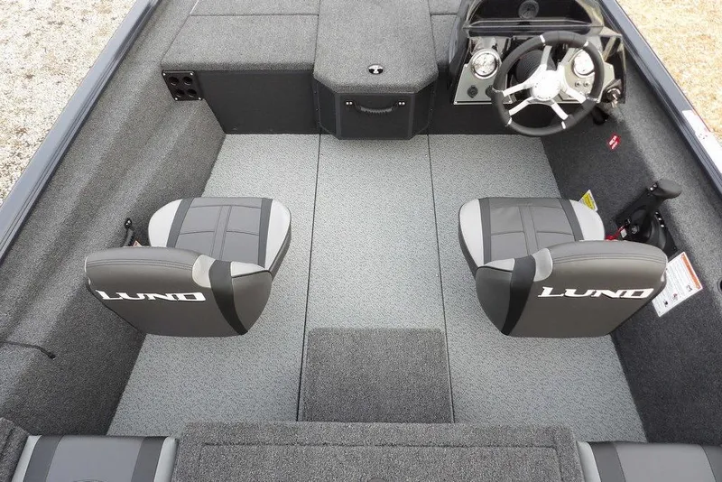 Slide: The Image of 2026 Lund 1875 Renegade boat interior with dual seats and steering console. - 20