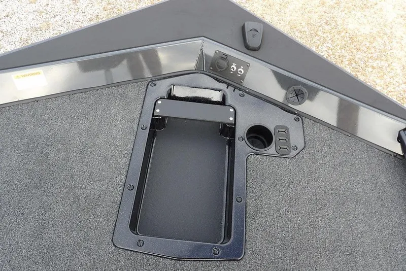 Slide: The Image of 2026 Lund 1875 Renegade boat deck with storage compartment and control panel. - 34