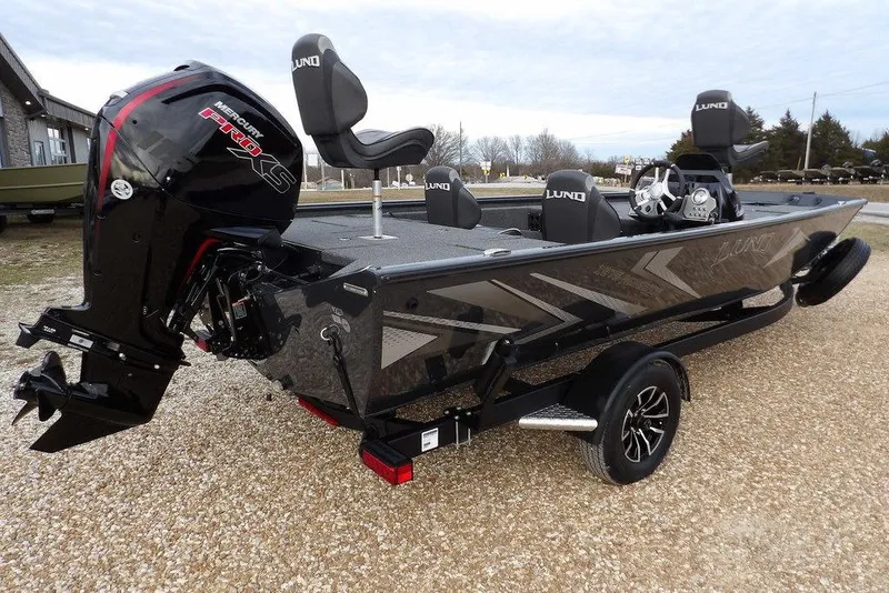 Slide: The Image of 2026 Lund 1875 Renegade boat with Mercury Pro XS engine on a trailer. - 6