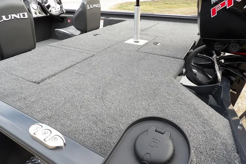 Slide: The Image of 2026 Lund 1875 Renegade boat interior with carpeted deck and seating. - 7